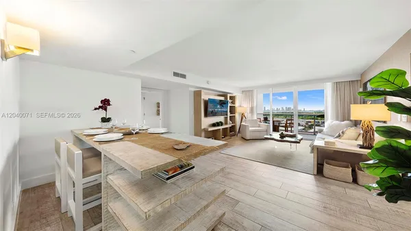 a living room with furniture and a table