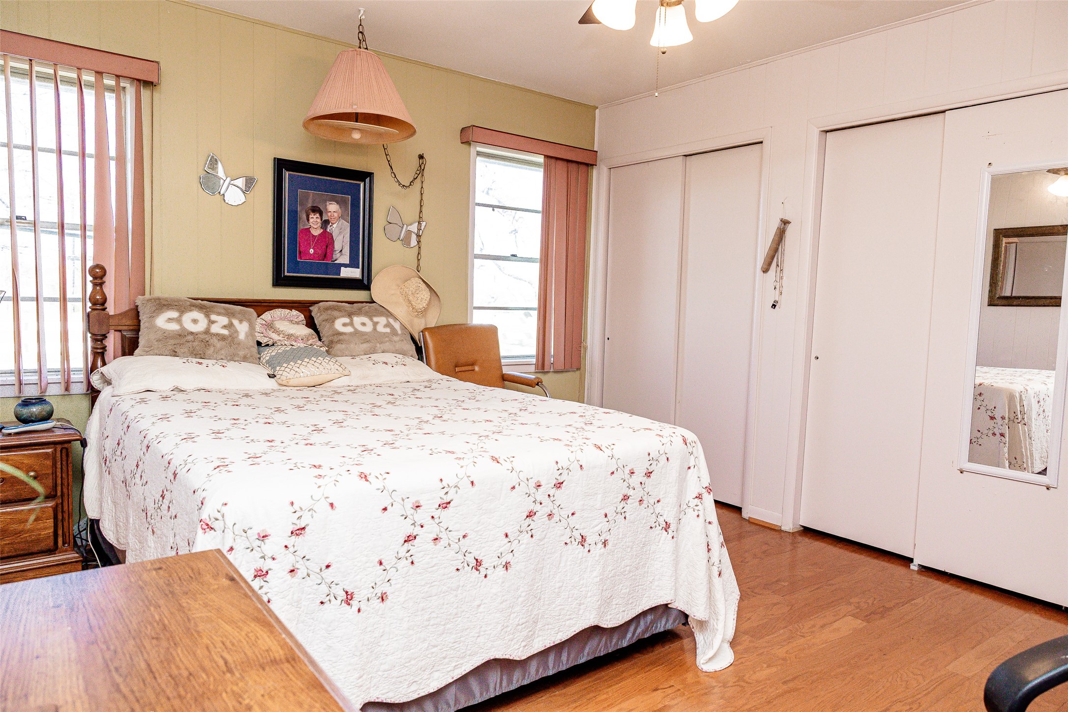 8608 Captain Scott Road Brenham, TX 77833 - Photo 9 of 28 a bedroom with a bed and a chandelier
