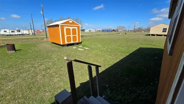 a view of a backyard of the house
