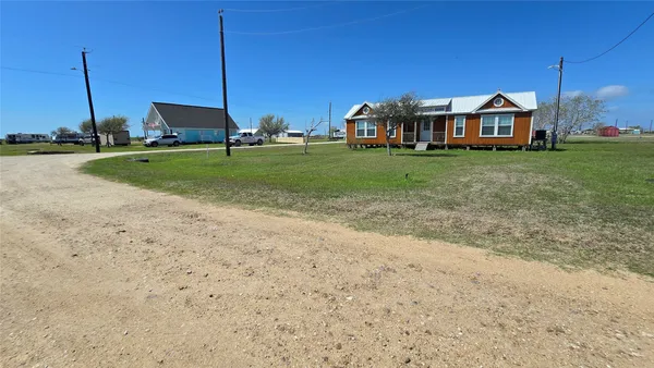 a view of a house with a big yard