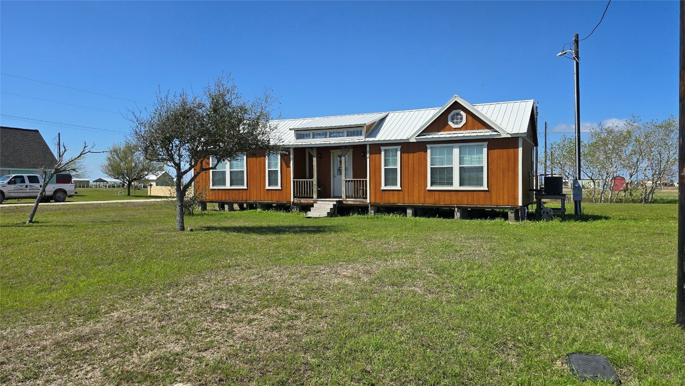 354 Haddock Palacios, TX 77465 - Photo 3 of 21 a front view of a house with a yard