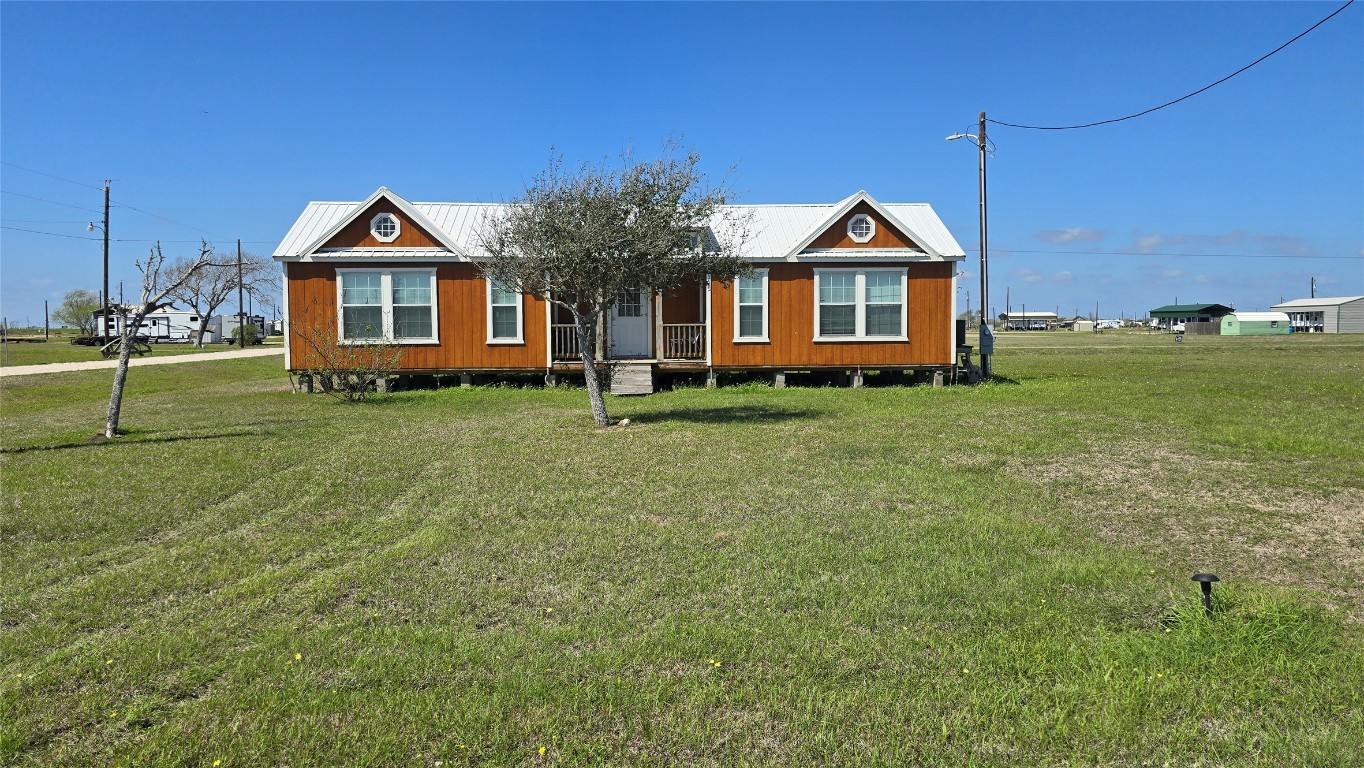 354 Haddock Palacios, TX 77465 - Photo 5 of 21 a front view of a house with a yard