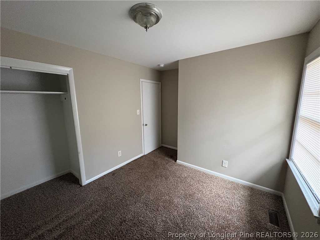 440 North Grogg Street Spring Lake, NC 28390 - Photo 14 of 23 an empty room with a empty space and window