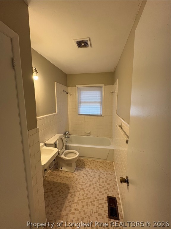 440 North Grogg Street Spring Lake, NC 28390 - Photo 15 of 23 a bathroom with a sink and a mirror