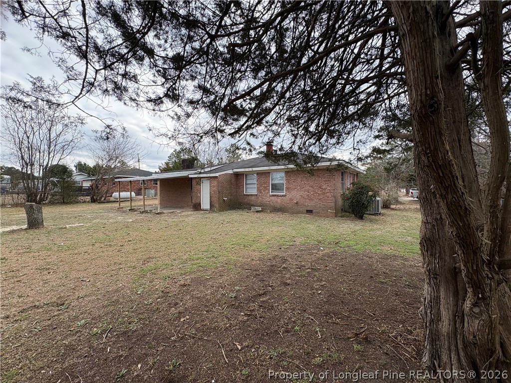 440 North Grogg Street Spring Lake, NC 28390 - Photo 21 of 23 a view of a house with a yard