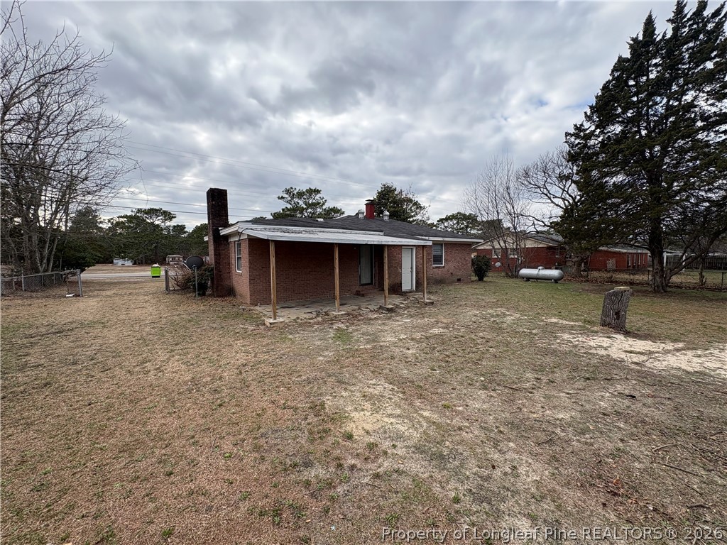 440 North Grogg Street Spring Lake, NC 28390 - Photo 23 of 23 a view of a house with a yard and sitting area