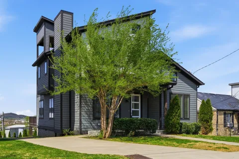 a front view of a house with garden