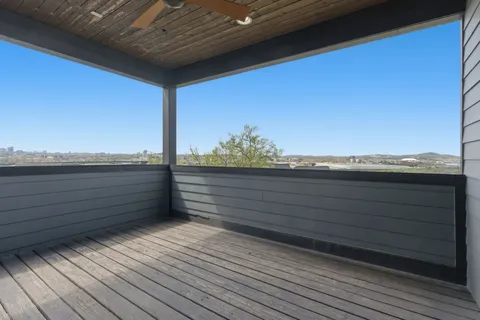 a view of deck with wooden floor and fence