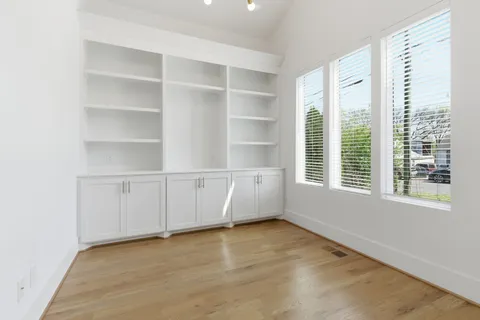 a view of an entryway with wooden floor