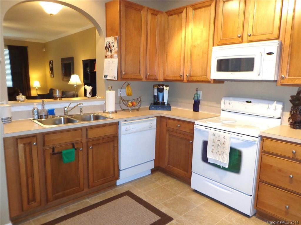 913 Copperstone Lane, Unit 188 Fort Mill, SC 29708 - Photo 12 of 24 a kitchen with a sink stove and microwave