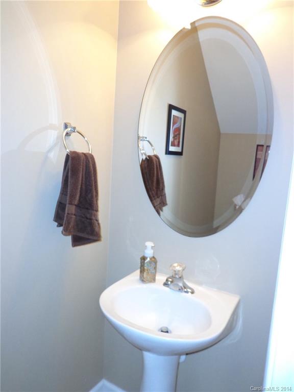 913 Copperstone Lane, Unit 188 Fort Mill, SC 29708 - Photo 13 of 24 a bathroom with a sink and mirror