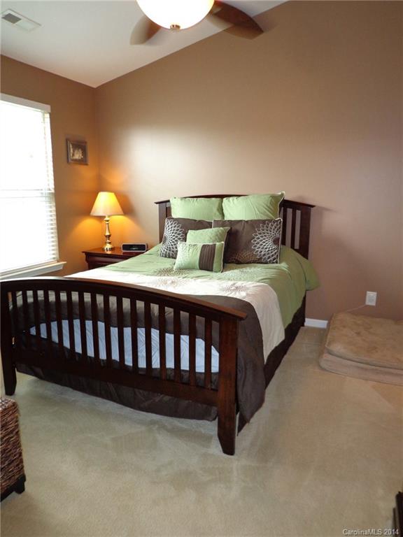 913 Copperstone Lane, Unit 188 Fort Mill, SC 29708 - Photo 16 of 24 a bedroom with a bed and window