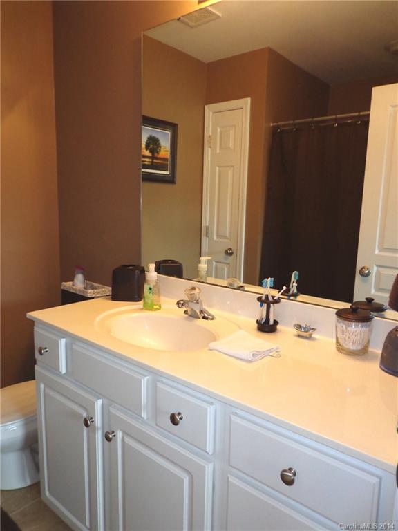 913 Copperstone Lane, Unit 188 Fort Mill, SC 29708 - Photo 17 of 24 a bathroom with a sink and a mirror