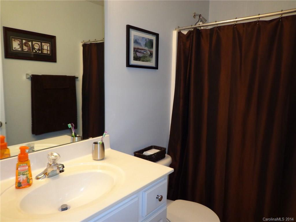 913 Copperstone Lane, Unit 188 Fort Mill, SC 29708 - Photo 20 of 24 a bathroom with a sink and a mirror