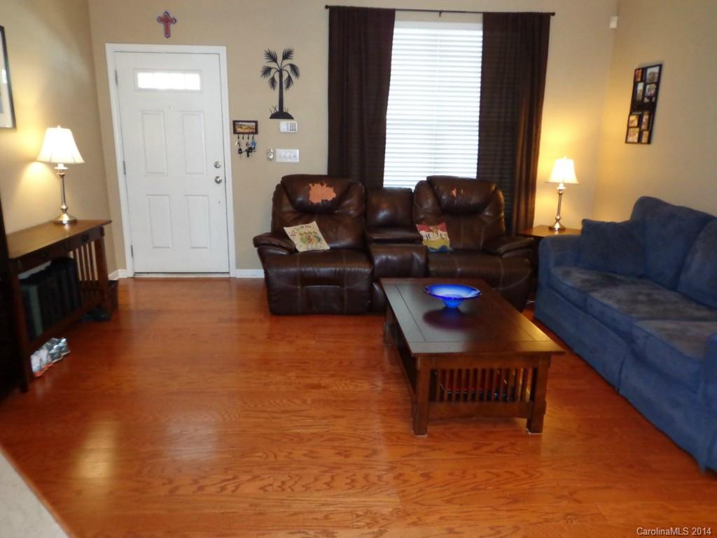 913 Copperstone Lane, Unit 188 Fort Mill, SC 29708 - Photo 3 of 24 a living room with furniture a window and a flat screen tv