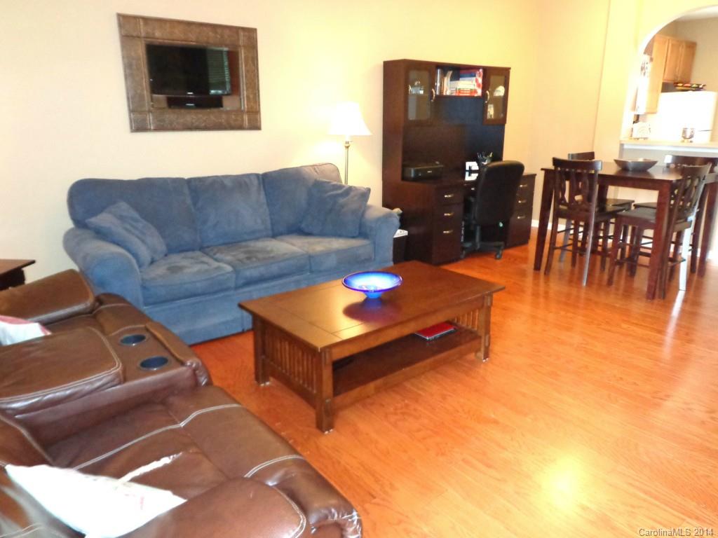 913 Copperstone Lane, Unit 188 Fort Mill, SC 29708 - Photo 4 of 24 a living room with furniture and a flat screen tv