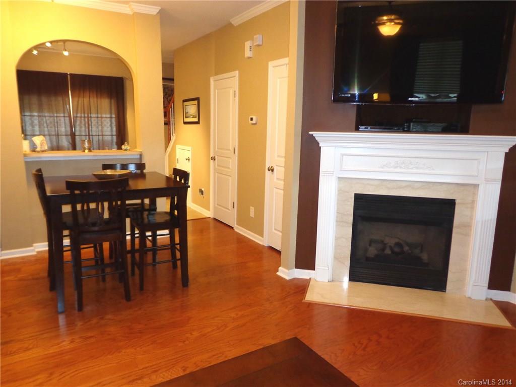 913 Copperstone Lane, Unit 188 Fort Mill, SC 29708 - Photo 8 of 24 a view of a dining room with furniture and chandelier