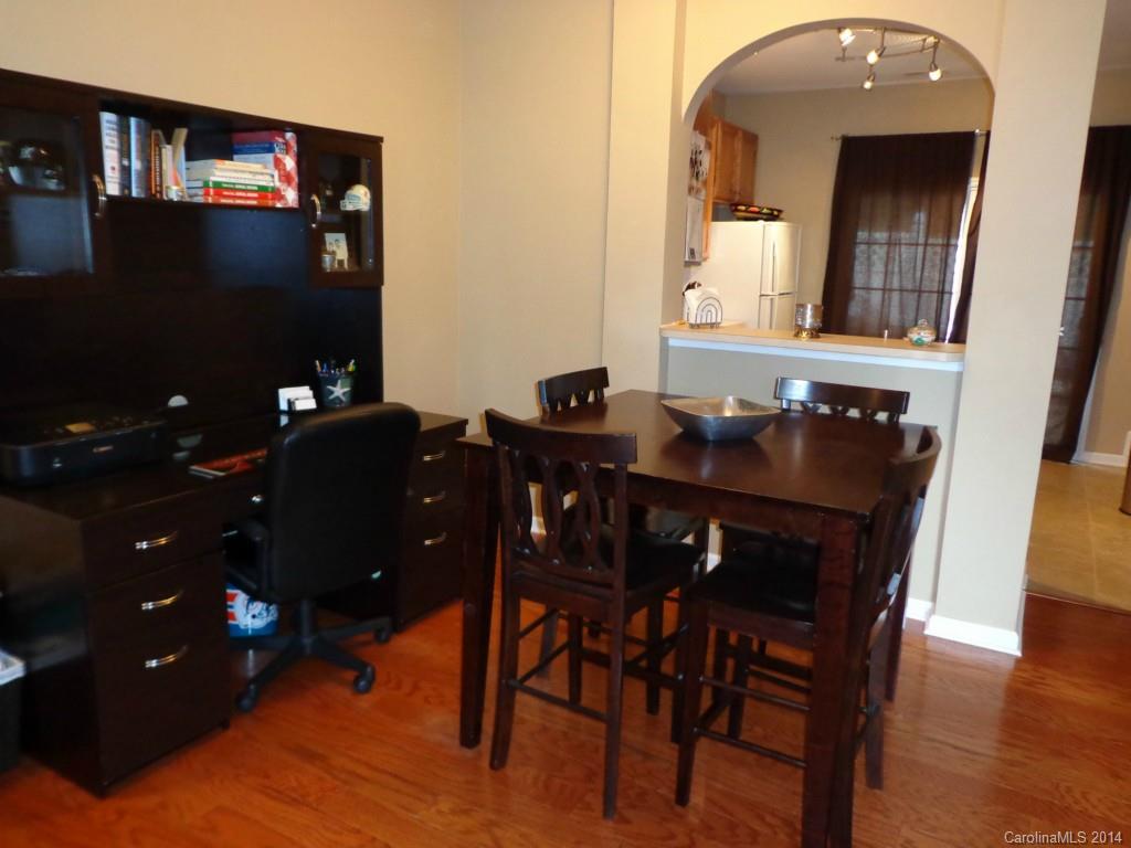 913 Copperstone Lane, Unit 188 Fort Mill, SC 29708 - Photo 9 of 24 a dining room with furniture and wooden floor