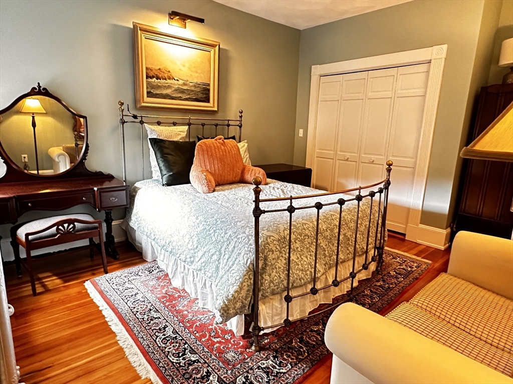24 Beaufort Road, Unit 3 Boston, MA 02130 - Photo 12 of 25 a living room with furniture and a wooden floor