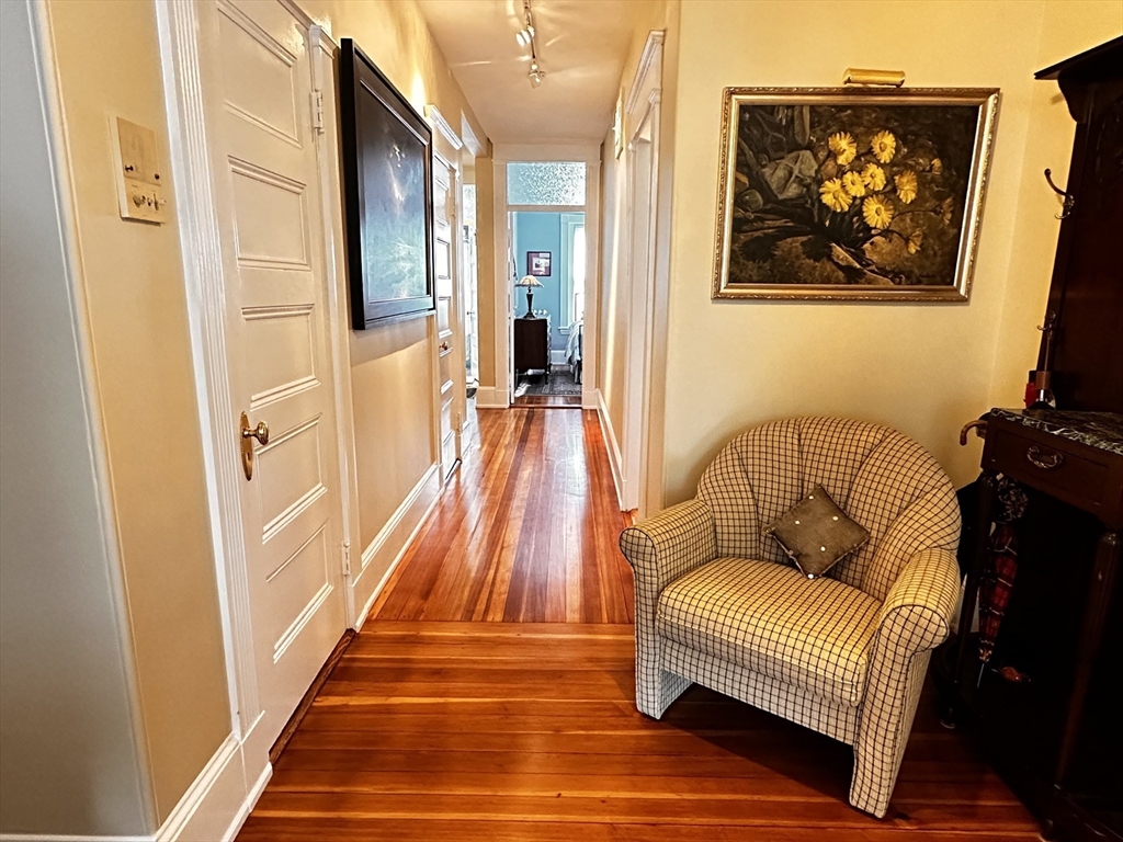24 Beaufort Road, Unit 3 Boston, MA 02130 - Photo 13 of 32 a living room with furniture and a rug