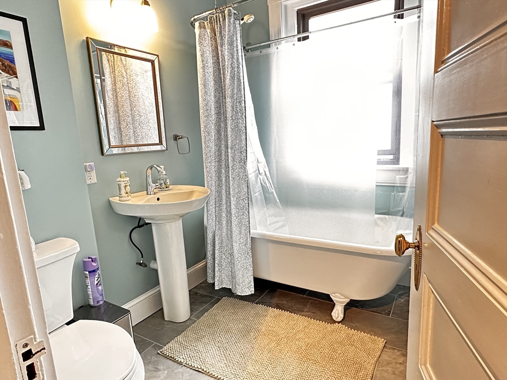 24 Beaufort Road, Unit 3 Boston, MA 02130 - Photo 14 of 32 a bathroom with a sink toilet and a bathtub