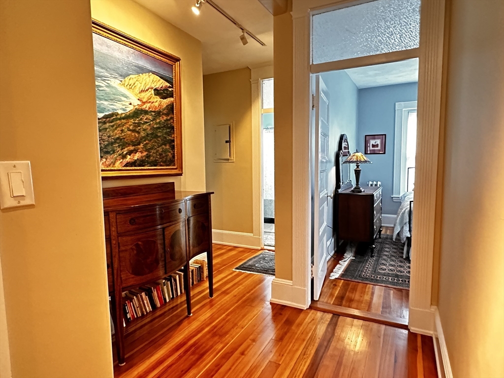 24 Beaufort Road, Unit 3 Boston, MA 02130 - Photo 15 of 25 a living room with furniture and a rug