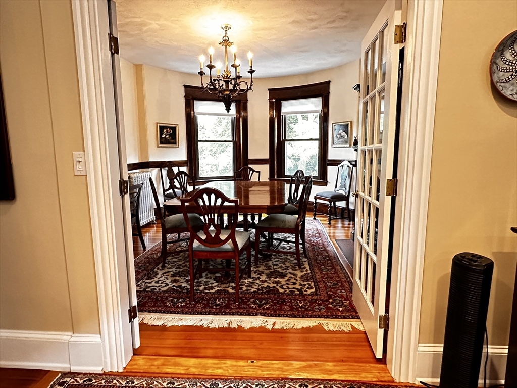 24 Beaufort Road, Unit 3 Boston, MA 02130 - Photo 15 of 32 a view of a dining room with furniture and a rug