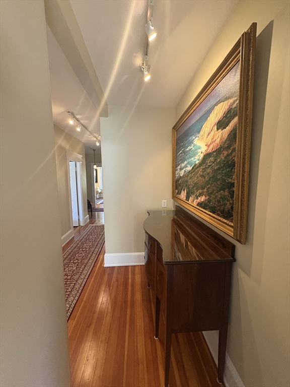 24 Beaufort Road, Unit 3 Boston, MA 02130 - Photo 19 of 32 a view of hallway with a large window and wooden floor