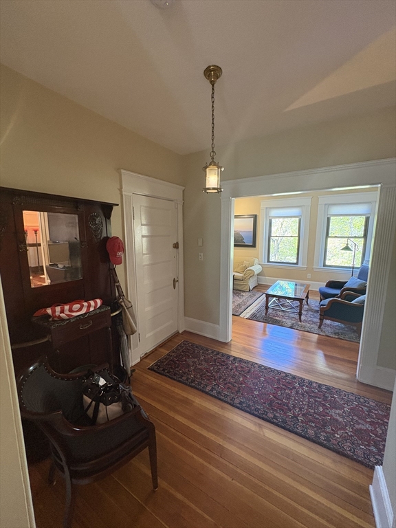 24 Beaufort Road, Unit 3 Boston, MA 02130 - Photo 20 of 32 a living room with furniture and a wooden floor