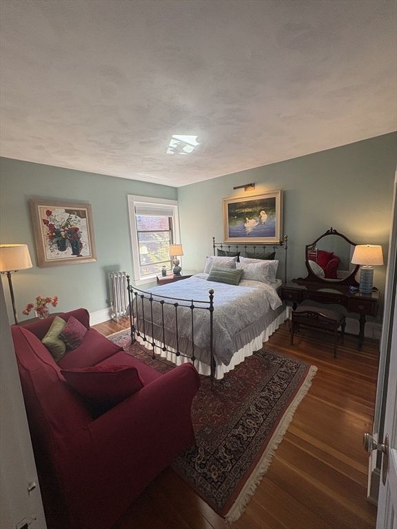 24 Beaufort Road, Unit 3 Boston, MA 02130 - Photo 21 of 32 a bedroom with furniture and a rug
