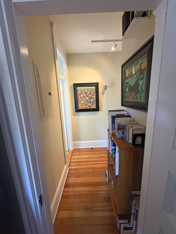 24 Beaufort Road, Unit 3 Boston, MA 02130 - Photo 24 of 32 a view of a hallway with wooden floor and stairs