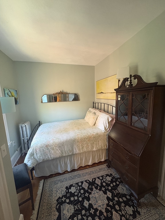 24 Beaufort Road, Unit 3 Boston, MA 02130 - Photo 25 of 32 a bedroom with a bed and a chair