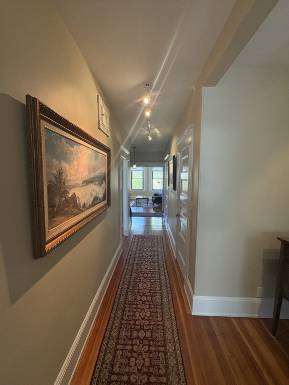24 Beaufort Road, Unit 3 Boston, MA 02130 - Photo 26 of 32 a view of a hallway with wooden floor