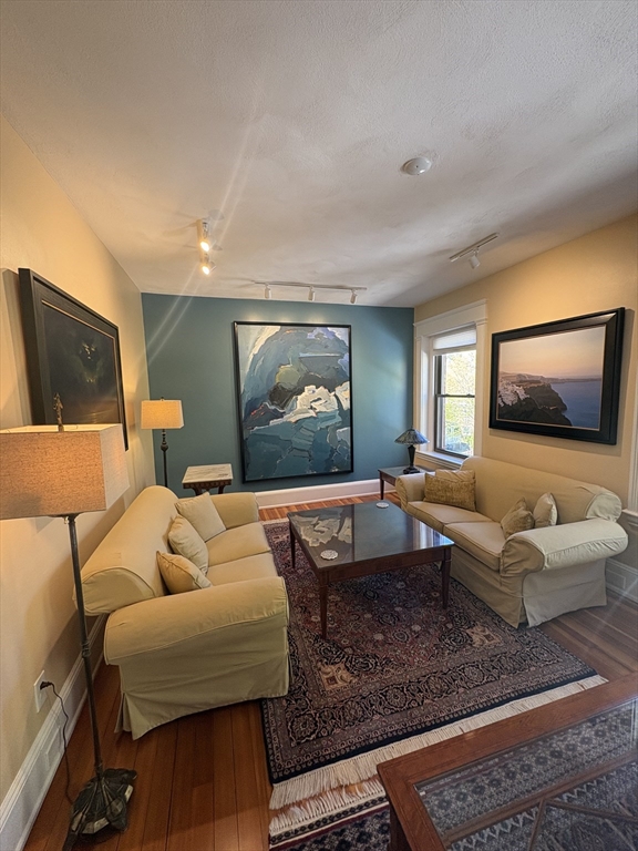 24 Beaufort Road, Unit 3 Boston, MA 02130 - Photo 29 of 32 a living room with furniture and a flat screen tv