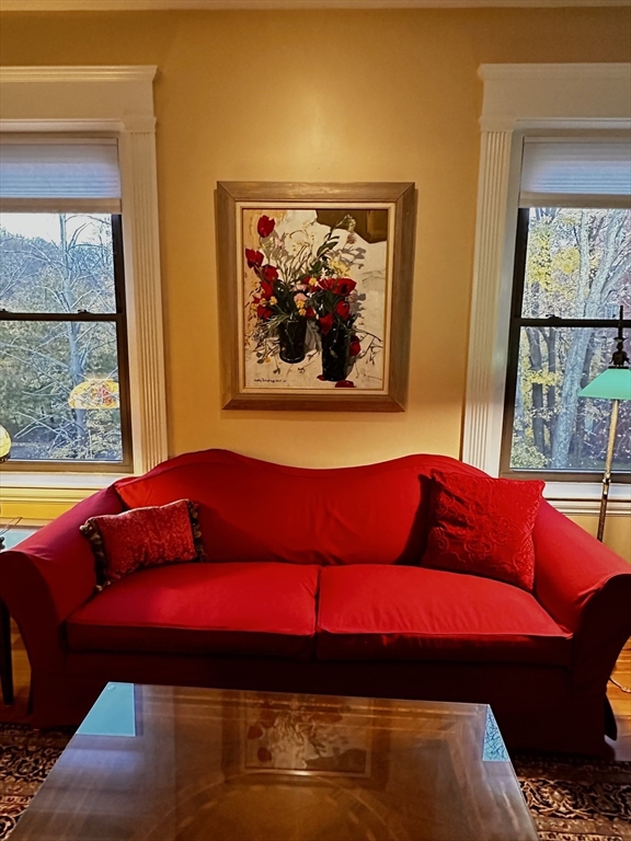 24 Beaufort Road, Unit 3 Boston, MA 02130 - Photo 8 of 25 a living room with a bed and a painting on the wall