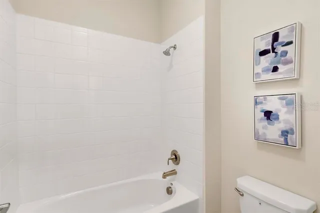 a bathroom with a bathtub and shower