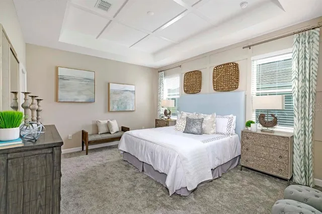 a bedroom with a bed and a couch