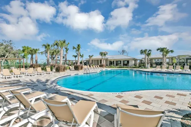 a view of a swimming pool with a patio