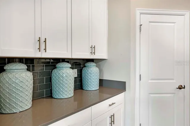 a view of cabinets and window