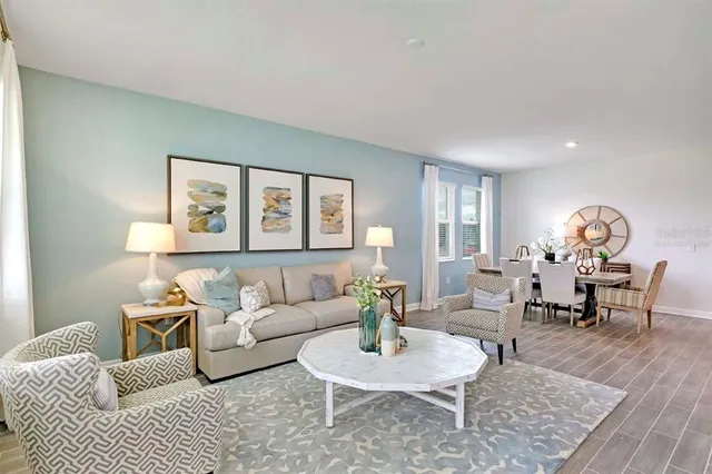 a living room with furniture and a table