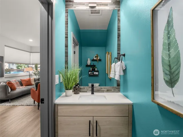 a bathroom with a sink and a mirror