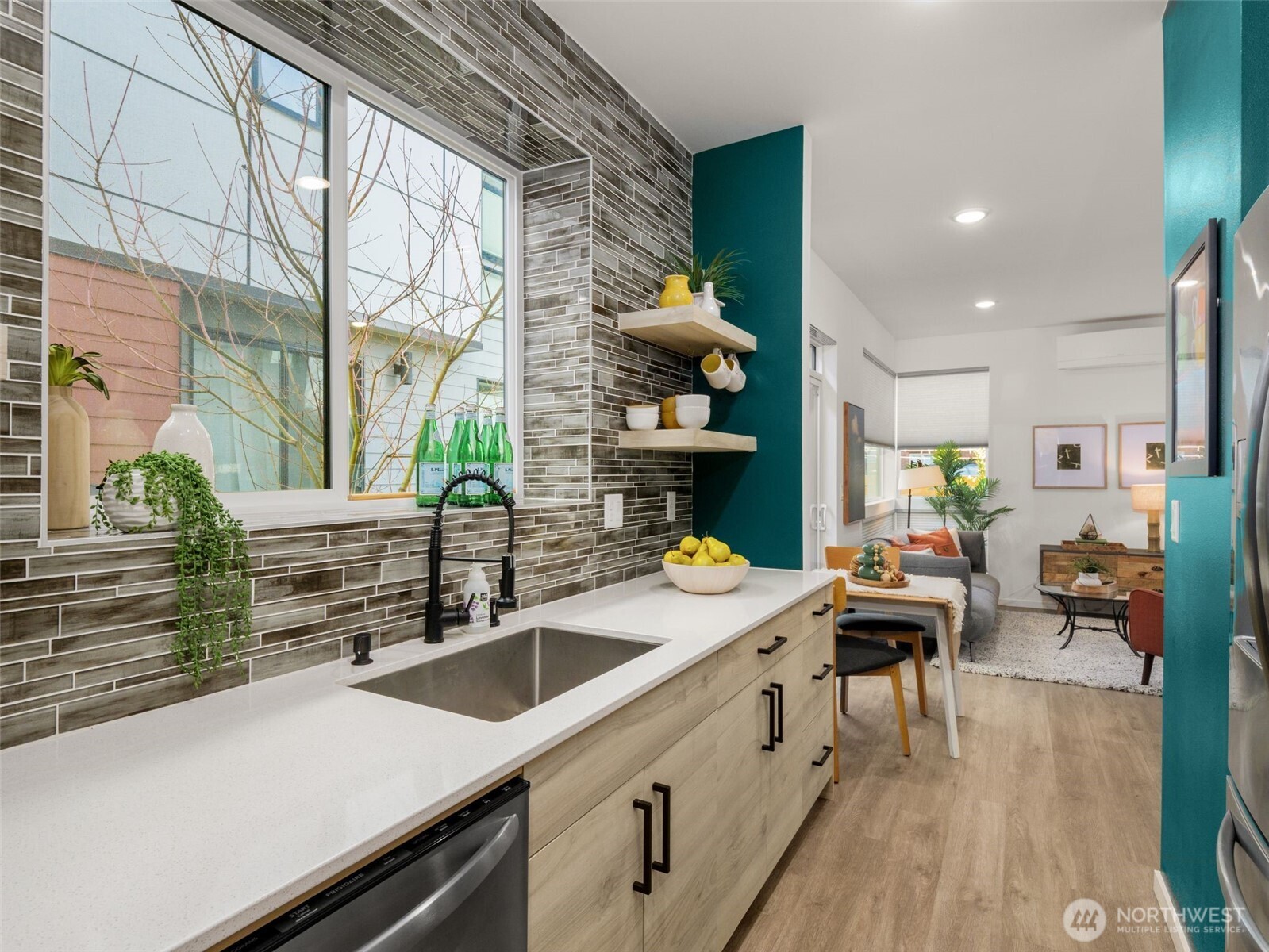 541 South Cloverdale Street, Unit B Seattle, WA 98108 - Photo 12 of 29 a kitchen with a sink appliances and cabinets
