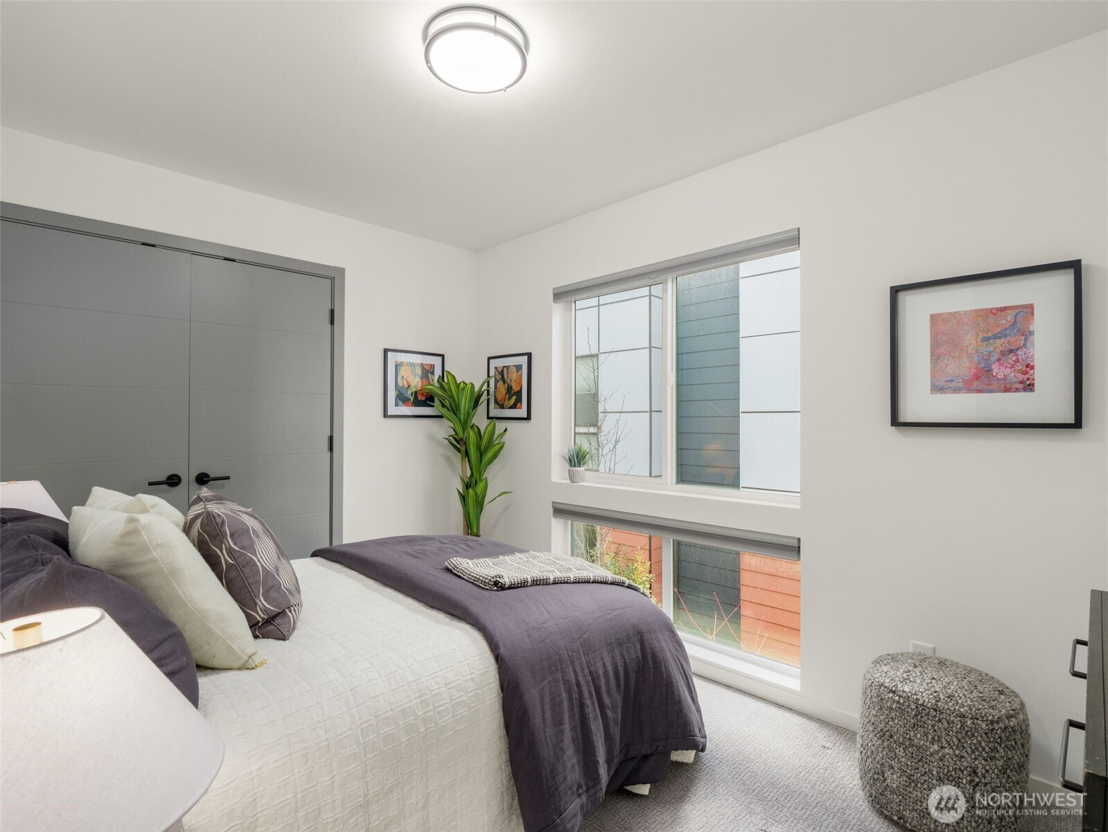 541 South Cloverdale Street, Unit B Seattle, WA 98108 - Photo 16 of 29 a bedroom with a bed painting on wall and a window