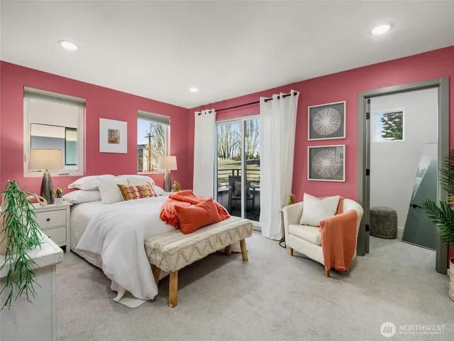 a spacious bedroom with a bed and a couch