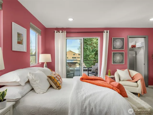 a bedroom with a bed and glass window
