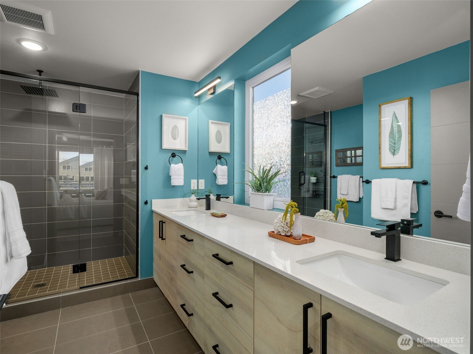 541 South Cloverdale Street, Unit B Seattle, WA 98108 - Photo 20 of 29 a bathroom with a shower sink and mirror