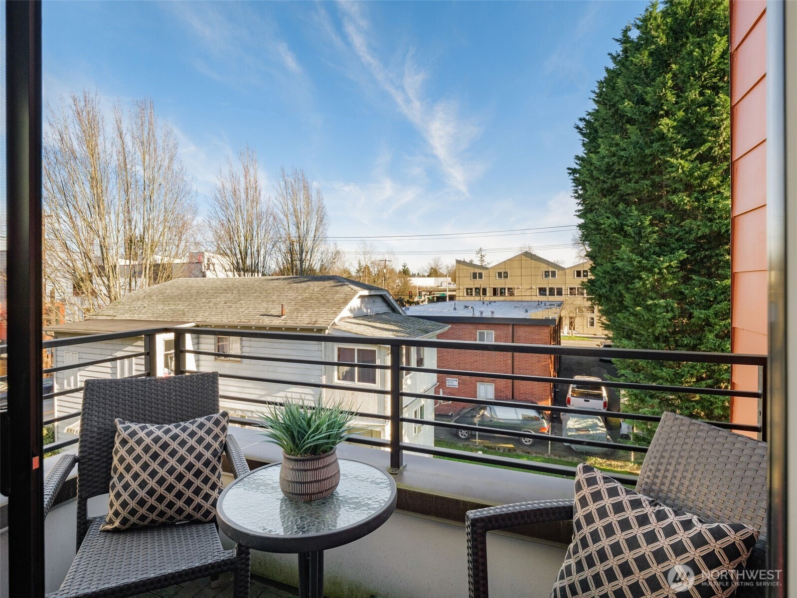 541 South Cloverdale Street, Unit B Seattle, WA 98108 - Photo 23 of 29 a view of a chairs and table on the deck