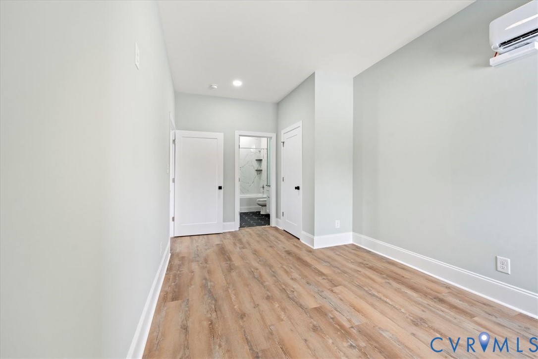 207 East Broadway, Unit B Hopewell, VA 23860 - Photo 2 of 27 a view of a big room with wooden floor and closet