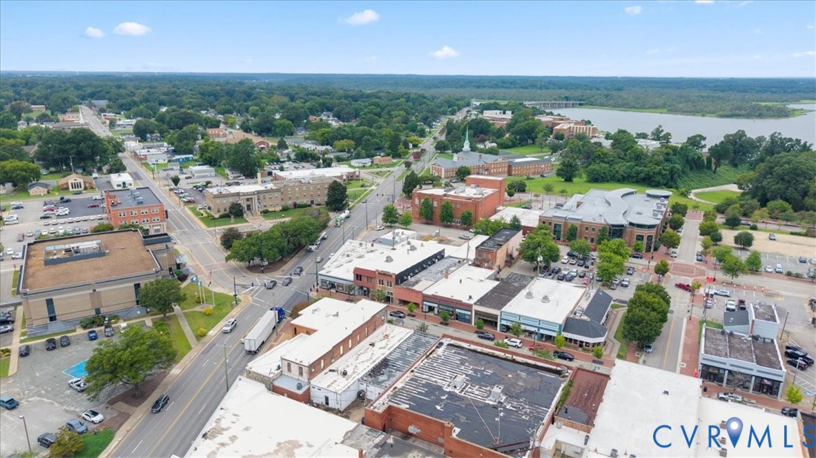 207 East Broadway, Unit B Hopewell, VA 23860 - Photo 9 of 27 an aerial view of a city with lots of residential buildings and mountain view in back
