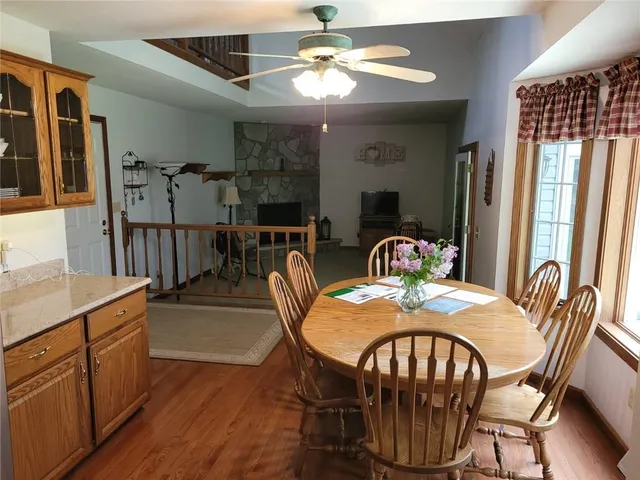 a view of a dining room with furniture window and wooden floor